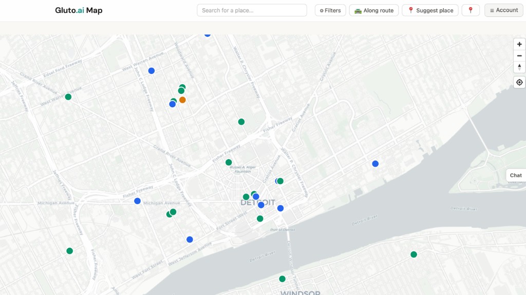 The Gluto.ai Food Map centered on Detroit, showing green, blue and orange pins across downtown, Corktown, Midtown and across the river toward Windsor, with a search bar, Filters, Along route and Suggest place controls